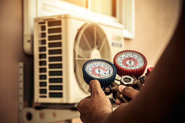 Professional Air Conditioning Service technician working in Hiawatha, KS